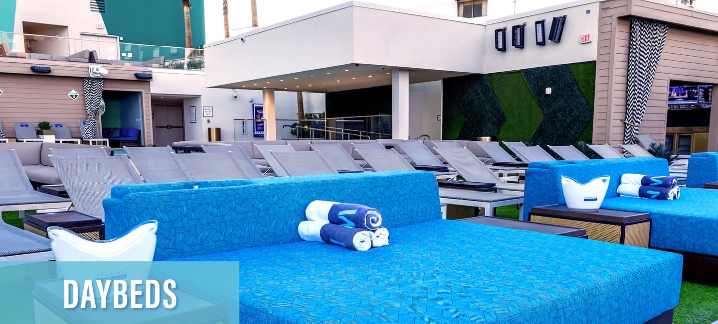 Daybeds beside the pools at Stadium Swim